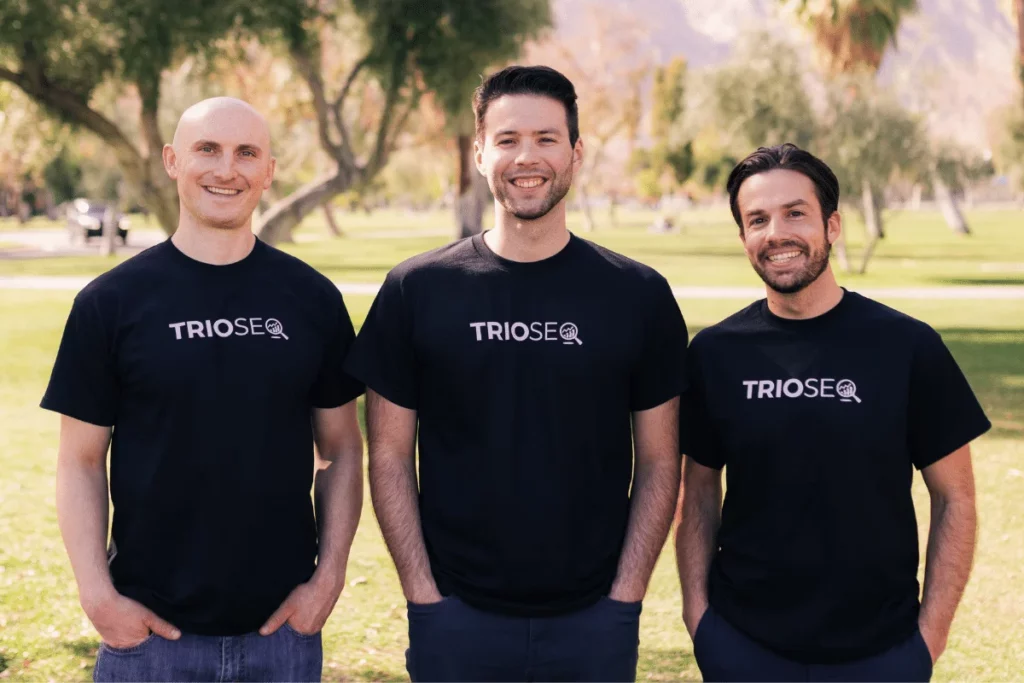Team photo of Connor, Steven, Nathan in black TRIOS® shirts outdoors.